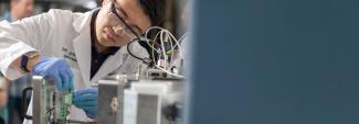researcher working on equipment in lab